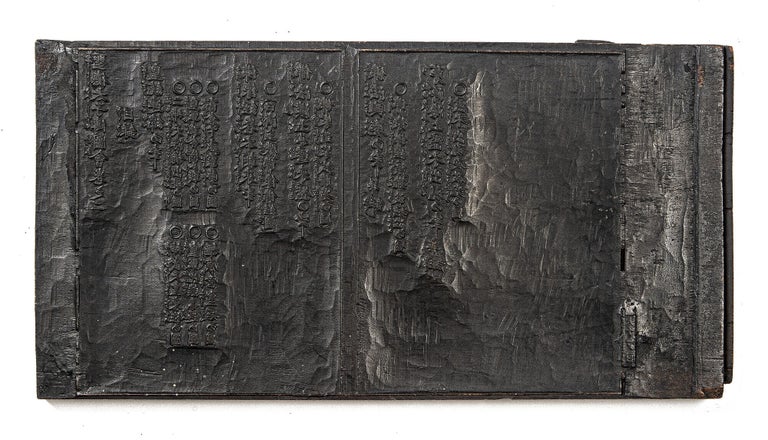 Item ID: 11529 Two woodblocks, carved on both sides, used in printing the first four consecutive...